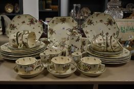 A Royal Doulton Old Leeds Spray's Pattern part dinner service, No 597783, having angular handles and