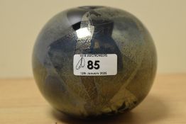 A John Ditchfielf iridescent art glass vase, of spherical form and decorated in an abstract