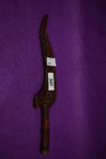 A 19th century carved knitting stick, of traditional 'wing' form with carved and turned detail,