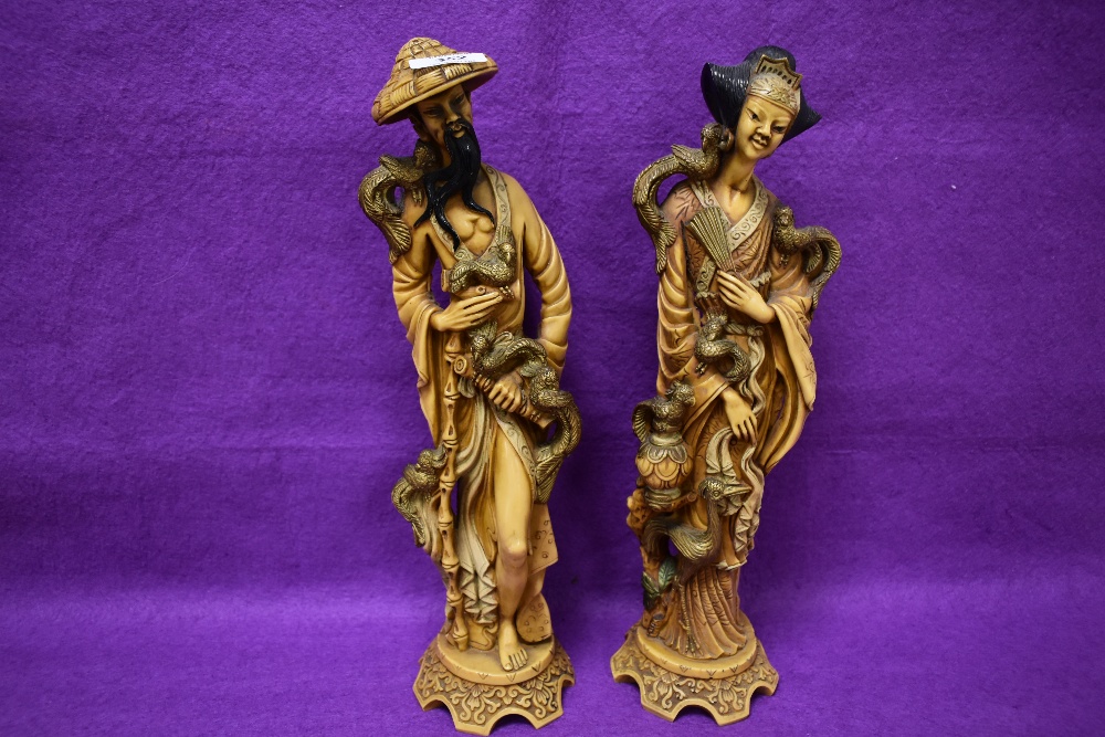 A pair of large reproduction simulated ivory figures, of Oriental design 38cm