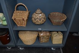 An ethnic African woven-fibre lidded vessel and similar bowl, sold alog with a woven-wicker hamper