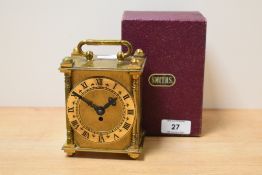 A small English Smith's travel clock, the top engraved with foliage decoration, h11. *A note was