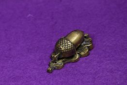 An unusual cast-brass acorn and oak leave door knocker, of small proportions 7cm
