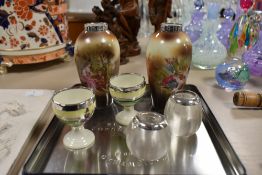 A pair of late 19th / early 20th century miniature porcelain vases, having silver rim and a