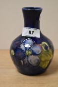 A small mid-century Moorcroft pottery onion shaped vase in the Clematis pattern, h12cm
