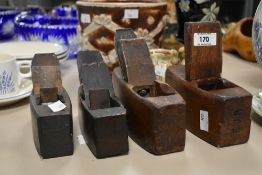 A set of 4 vintage wooden coffin shaped block planes, impressed mark 'L.Markey, E.J.R'.
