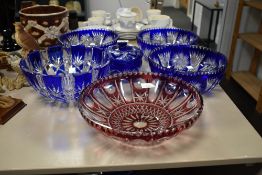 Five late 19th / early 20th century hand cut crystal bowls, four in cobalt blue and the other in