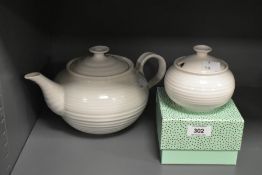A Sophie Conran Portmeirion teapot, having ribbed form and white glaze, h15cm, sold alongside a