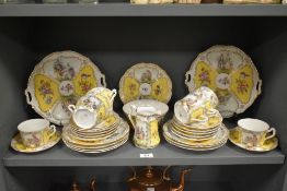 A 19th century C.T. Square plate German part dinner service, decorated depicting rustic lovers in