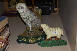 Two vintage painted cast iron fireside ornaments, in the form of a sheep and a barn owl, measuring