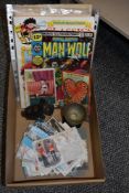 A box containing various mid-century comics and late 19th / early 20th century postcards, to include