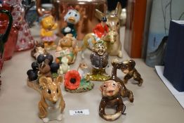 A selection of ceramic figures, to include three monkeys, a fox hunting figure, a garden gnome