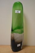 A 20th Century free form art glass sculpture, tinted in green and measuring 34cm tall