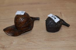 Two 19th century carved wooden inkwells, each formed as a nut, one with leaf form base