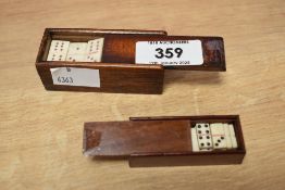 Two sets of late 19th/early 20th century mahogany cased miniature bone dominoes