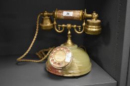 A vintage French style brass and onyx rotary telephone, h23cm.