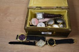 A metal jewellery box depicting boats, containing an assortment of wristwatches, including Lorus,
