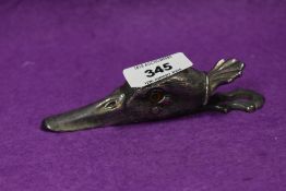 An unusual silver-plated/white metal duck head form letter clip, with inset glass eyes 12cm