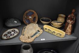 A vintage teracotta pottery figure, decorated in brown glaze, h26cm, sold alongside various other