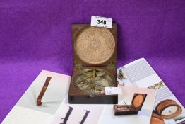A George III brass and mahogany combination sundial and compass, of hinged square form, the paper