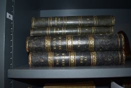 A 19th century leather bound Holy Bible, volume 1 and volume 2, having gilt decoration over