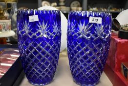 An attractive pair of cobalt blue overlay cut crystal vases, measuring 25cm.