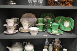 A Sutherland H & M Bone China part tea service, decorated in pink with gilt motifs, (18), sold