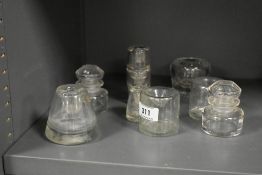 A group of 8 assorted glass inkwells, (8).