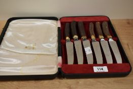 A cased set of stainless steel meat knifes, having antler handles and acid-etched mark 'Viners of
