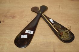 A set of mid-19th century eastern opium scales, housed within a pivoted mahogany club shaped