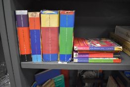 A group of Harry Potter books, to include Harry Potter and the Philosopher's Stone, the Chamber of