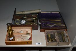 A group of measuring instruments, to include a boxed geometry set, a music notes box, a pedometer