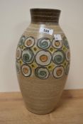 A decorative Denby stoneware ovoid vase, decorated with a band of roundal motifs, printed factory