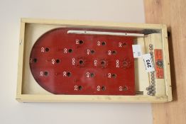 A miniature bagatelle games board manufactured by The Chad Valley Co, Ltd, appointment Toymakers