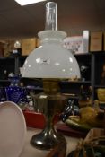 A vintage brass Rayo style oil lamp, having a glass dome top and chimney, h60