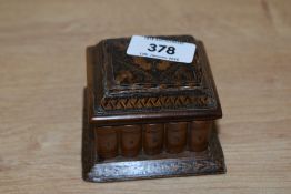 A small 19th century Tunbridge ware travelling inkwell, decorated displaying book spines to the