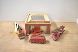 A Dinky Supertoys 954 Fire Station, damage seen as images, doors present along with two Dinky Die-