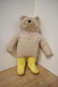 A Gabrielle Designs Paddington Bear wearing yellow Dunlop wellingtons, height 50cm