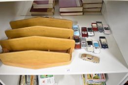 A Danbury Mint Classic Cars of the 60's set on wooden display shelf, all 12 cars present