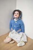 A early 20th century Armand Marseille bisque headed Doll having sleep eyes, open mouth with two