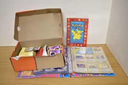 A collection of Topps Pokemon Cards in album and in box, most dated 2000, no 1st editions seen,