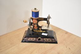 A vintage German Casige Child's Sewing Machine numbered 121