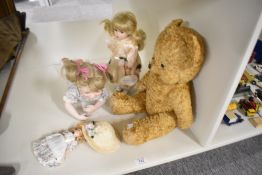 A mid 20th century straw filled yellow plush Teddy Bear having plastic eyes, stitched nose and