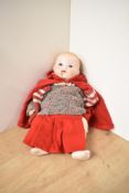 A early 20th century Armand Marseille bisque headed Doll having sleep open eyes, open mouth with two