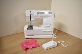 A modern Childs Zig-Zag Lockstitch Battery Operated Sewing Machine, 6+, in window display box