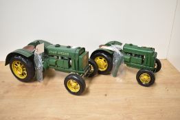 Two reproduction Lesser & Pavey Limited tin plate John Deere Model Tractors, both exhaust pipes