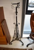 A Victorian wrought metal standard oil lamp stand