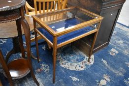 An Edwardian style mahogany bijouterie table on square tapered legs