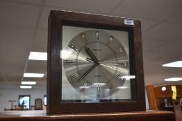 A vintage Toshiba battery powered wall clock, approx. 31 x 31cm