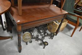 A Victorian mahogany side table, with frieze drawer to one end, dummy drawer to other end, approx.
